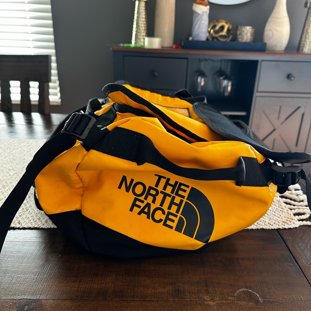 The North Face Yellow and Black Duffel Bag